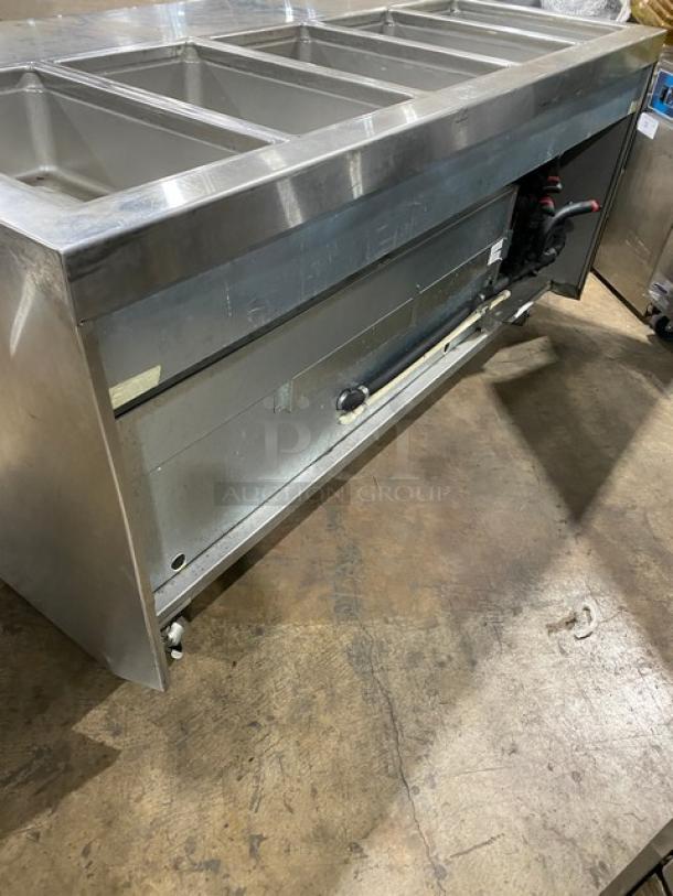 Delfield 18MC72P-1/3 stainless steel 4-drawer refrigerated prep table with 5 cold wells, on casters. Model 18MC72P13. 115V.