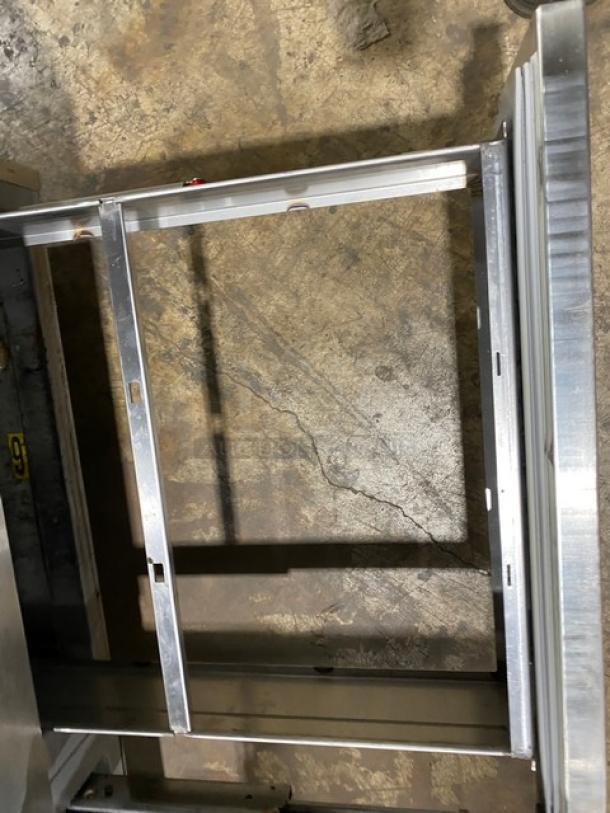 Delfield 18MC72P-1/3 stainless steel prep table frame, refrigerated, 4-drawer, 5 cold wells, on casters, used condition.