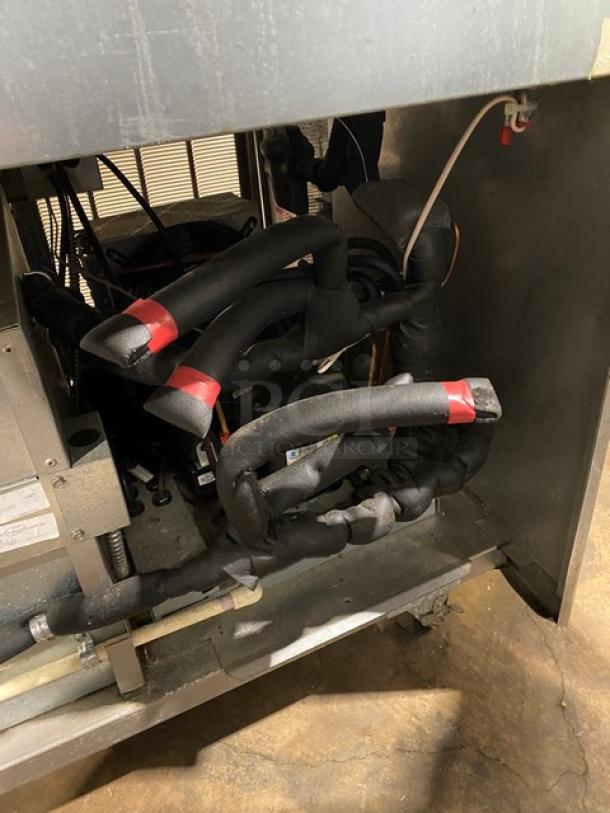 Delfield commercial prep table inner components, showing insulated pipes and wiring. Model 18MC72P13.