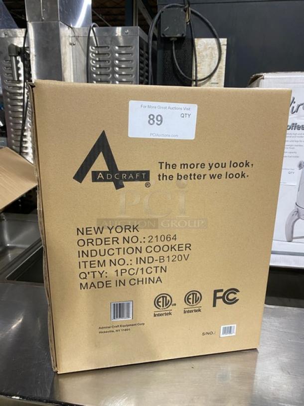 Cardboard box for Adcraft IND-B120V induction cooker, new condition, labeled with model, item number, and certifications.