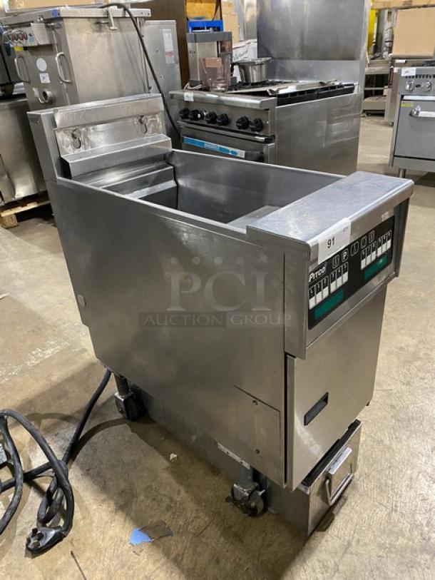 Pitco SFSE14S commercial electric fryer, stainless steel, with backsplash, basket hanger, filtration system, on casters.