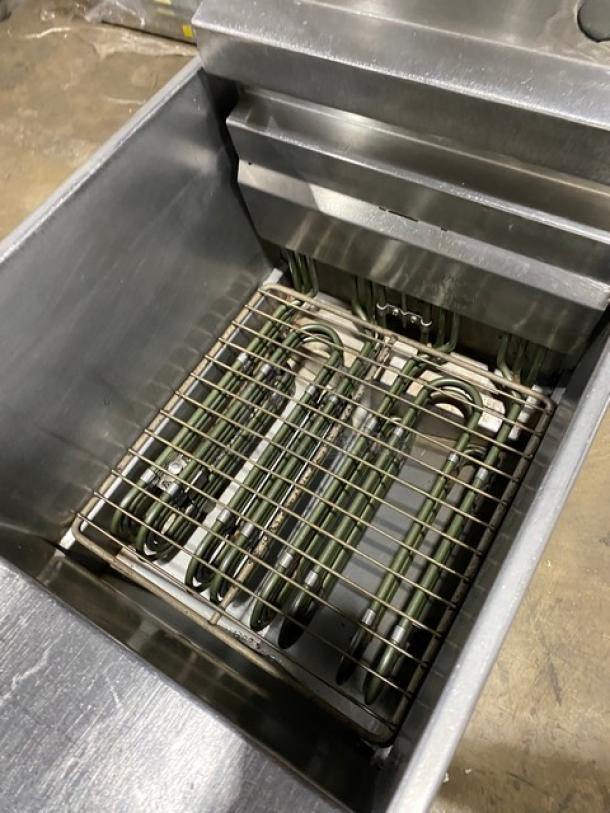 Pitco SFSE14-S commercial electric fryer, stainless steel, with filtration system, backsplash, and basket hanger, on casters.