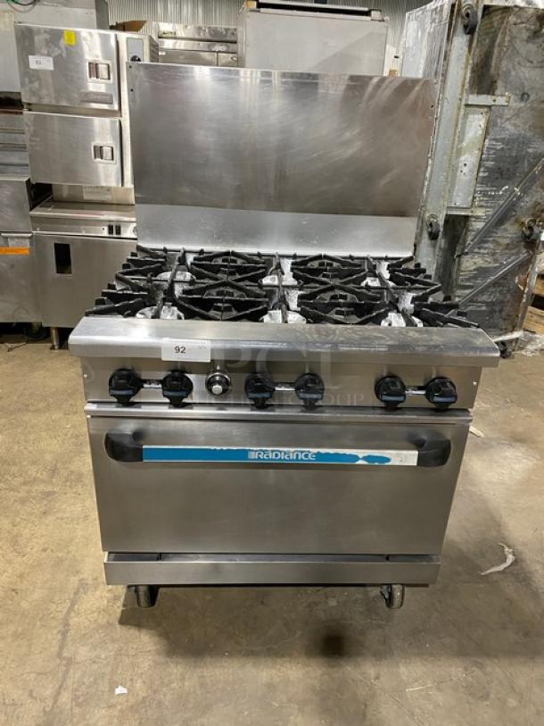 Radiance commercial stainless steel gas-powered 6-burner range/oven combo with backsplash, wired oven rack, on casters.