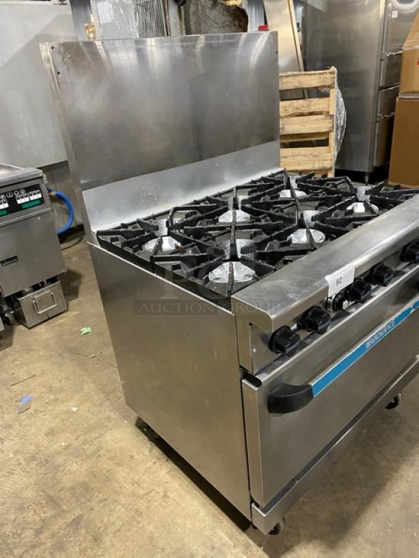 Radiance stainless steel 6-burner gas range/oven combo with back splash, wired oven rack, and casters.