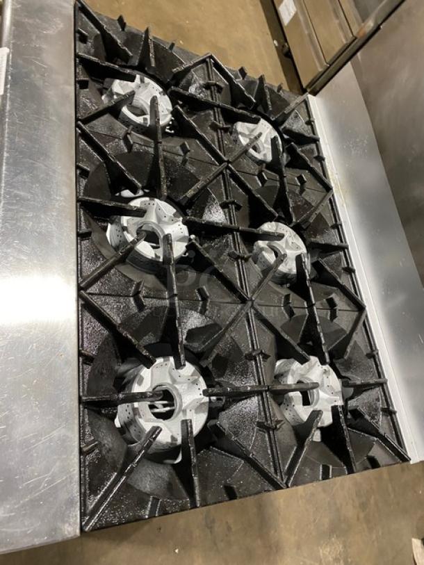 Radiance 6-burner stainless steel gas range/oven combo with backsplash, wired oven rack, and casters, excellent condition.