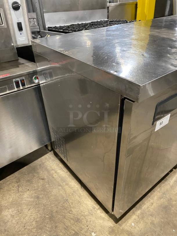 Coldline stainless steel 3-door worktop refrigerator, with poly coated wired rack and casters, excellent condition.