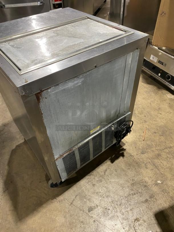 Beverage-Air SP27 stainless steel refrigerated salad/sandwich prep table, single door, with poly-coated rack, on casters.