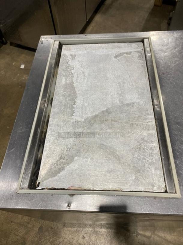 Beverage-Air SP27 stainless steel single door refrigerated prep table, with poly coated wire rack, on casters.