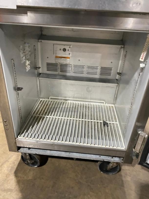 Beverage-Air SP27 stainless steel refrigerated prep table, single door, with poly coated wired rack, on casters.