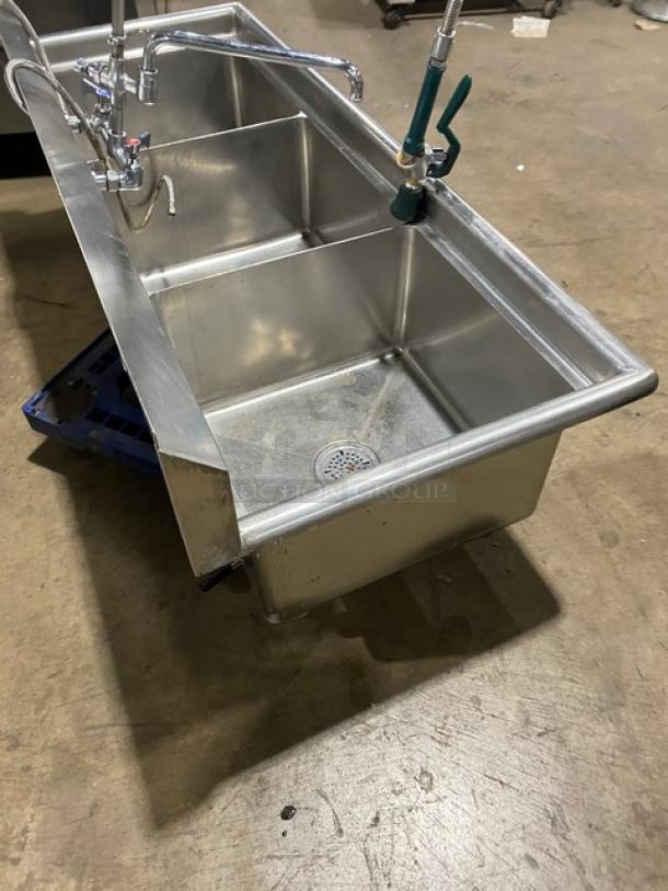 Commercial stainless steel 3-compartment sink with backsplash, swivel faucet, jet spray, and legs; used condition.