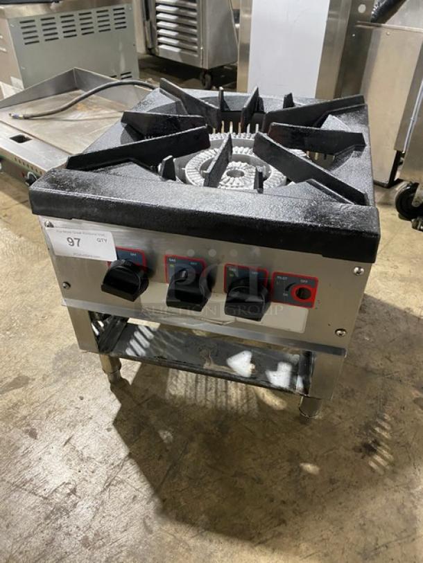 Commercial stainless steel single burner stock pot range on legs; features gas-powered controls. Clean, robust condition.