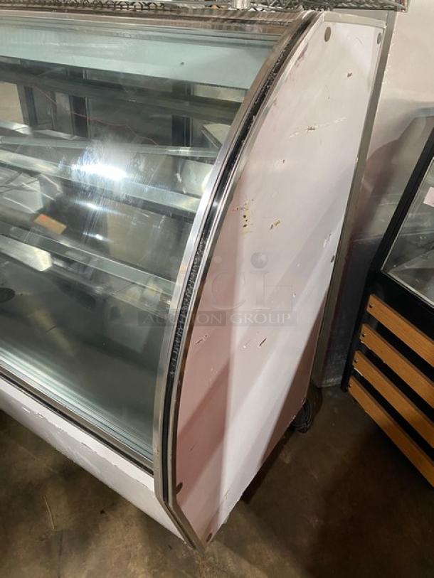 Leader NRHD96R stainless steel 96" refrigerated display case, curved glass, rear sliding doors, overstock storage.