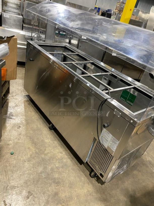 Turbo Air stainless steel 3-door refrigerated buffet table with sneeze guard, model JBT-72-N, on casters, good condition.
