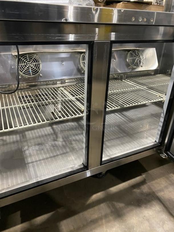 Turbo Air JBT72N stainless steel 3-door refrigerated buffet table with sneeze guard, poly-coated rack, on casters.