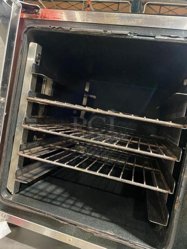 Moffat Turbofan Series stainless steel electric countertop convection oven with wired racks, showing interior condition.