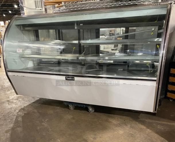 Leader NRHD96R 96" refrigerated meat/deli display case, curved glass, double sliding rear doors, lower storage, stainless steel.