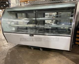 Leader NRHD96R 96" refrigerated meat/deli display case, curved glass, double sliding rear doors, lower storage, stainless steel.