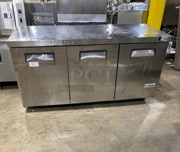Coldline commercial stainless steel 3-door worktop refrigerator on casters, with poly-coated wired rack, in used condition.