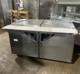 Turbo Air Super Deluxe 2-door refrigerated prep table, model TST-60SD-24-N, stainless steel, with cutting board and rack, on casters.