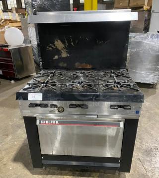 Garland stainless steel 6-burner gas range/oven combo with backsplash, overhead salamander shelf, wired oven rack. Used condition.