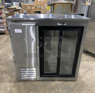 Leader LB48SC stainless steel 2-door refrigerated worktop, glass sliding doors, chrome plated rack, 48", 115V, on casters.