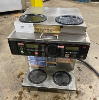 Bunn AXIOM22TWIN commercial coffee brewer, stainless steel, twin model with digital control, 4 warming plates, on legs.