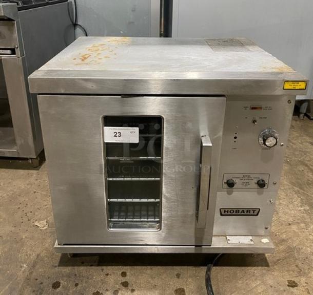 Hobart CN85 commercial stainless steel countertop convection oven, thermostatic control, wired rack, 208V, on legs.