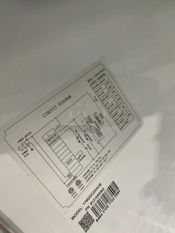 Avantco Commercial black glass door refrigerator, model 178GDC23HCB. Features poly coated wired rack, on casters. Serial tag visible.