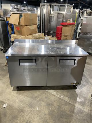 True TWT-60 stainless steel 2-door worktop refrigerator, Energy Star certified, with backsplash, poly-coated rack, on casters.