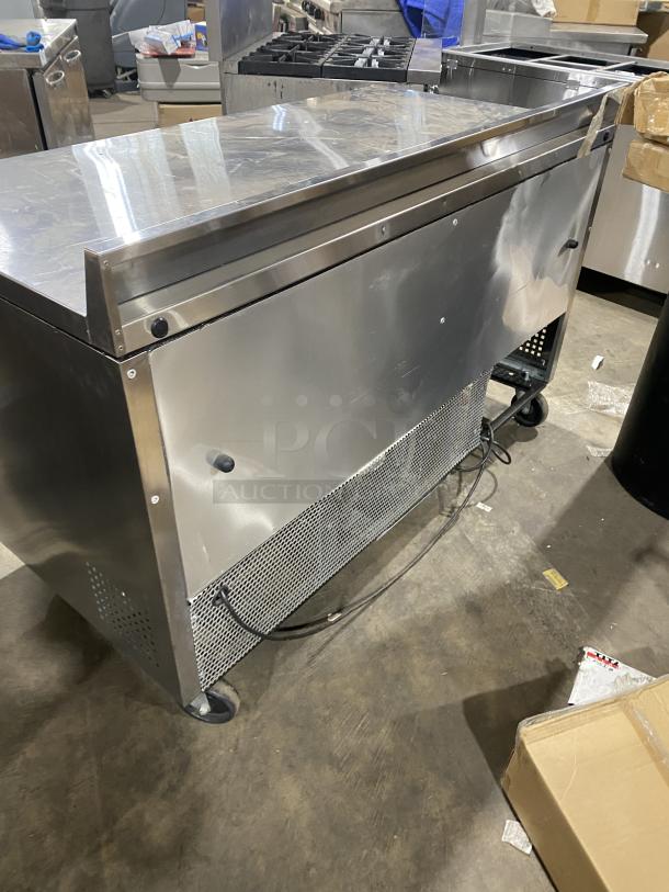 True TWT-60 commercial stainless steel 2-door worktop refrigerator, Energy Star certified, with backsplash and casters.