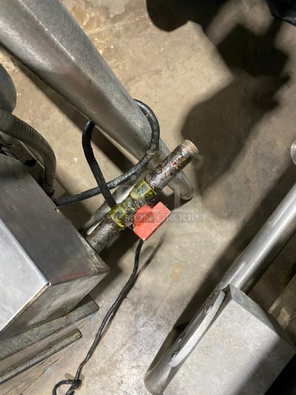 Groen Eclipse P40G commercial braising pan connection detail, showing natural gas hookup. Stainless steel, on legs.