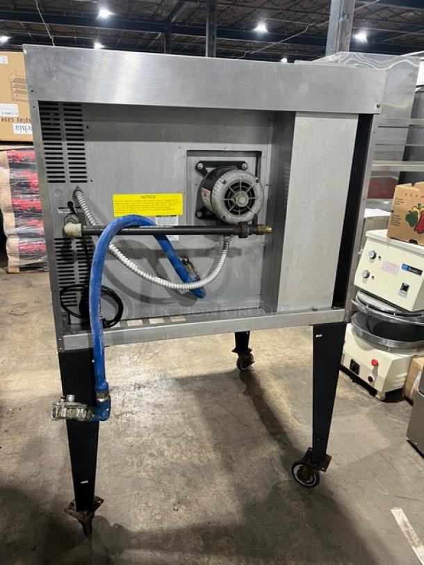 Bakers Pride GDCO-E1 commercial convection oven, electric powered, single deck, on casters, visible rear components.