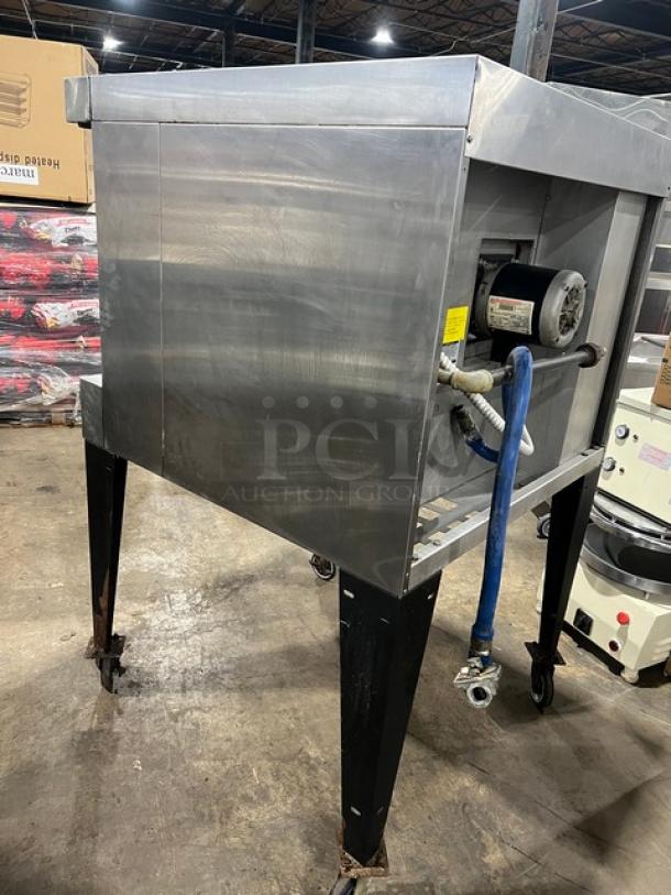 Bakers Pride GDCO-E1 single deck convection oven, stainless steel, on casters, visible motor and piping, good condition.