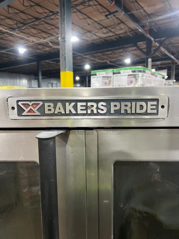 Bakers Pride GDCO-E1 commercial convection oven on casters. Visible logo and stainless steel exterior. Good condition.
