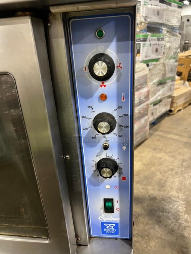 Bakers Pride GDCO-E1 convection oven control panel, showing temperature and fan settings. Oven on casters.
