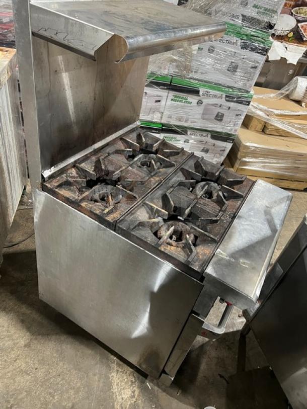 American Range stainless steel 4-burner gas range/oven combo, with backsplash and overhead salamander shelf. Good condition.