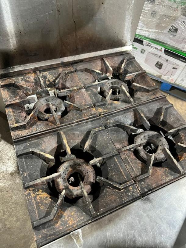 American Range stainless steel 4-burner natural gas range/oven combo, backsplash, overhead salamander shelf. Well-used condition.