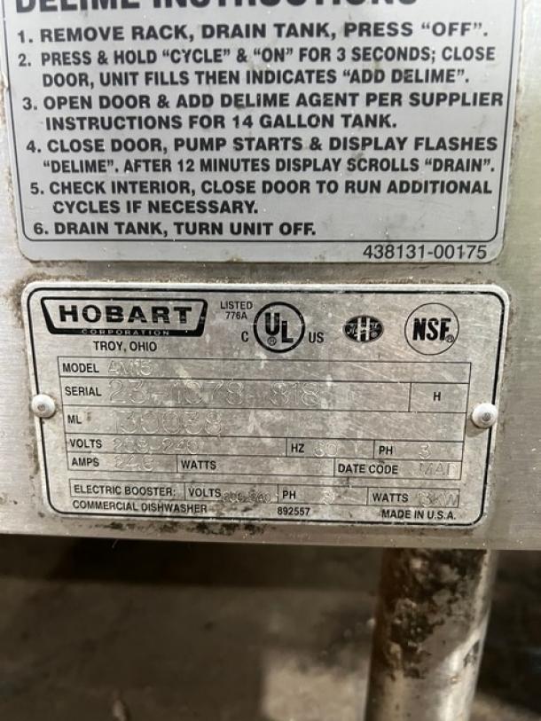 Hobart AM15 commercial dishwasher, stainless steel, high-temp, electric, 208-240V, 3 phase, model and serial numbers visible.