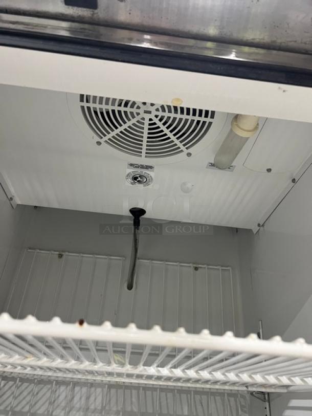 True T-23F stainless steel single door reach-in freezer, poly coated wired rack, Energy Star certified, 115V, on casters.