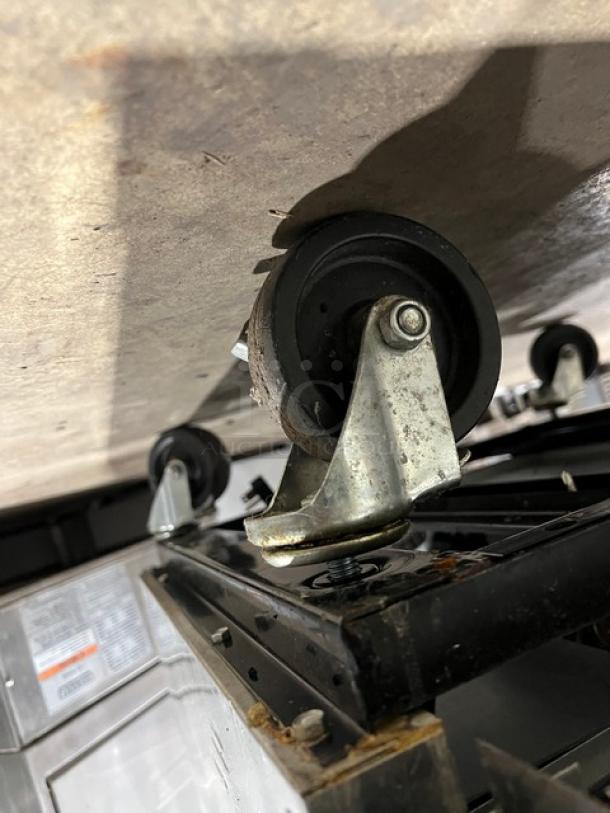 True T-23F commercial stainless steel reach-in freezer on casters; Energy Star certified; poly coated wired rack; 115V.