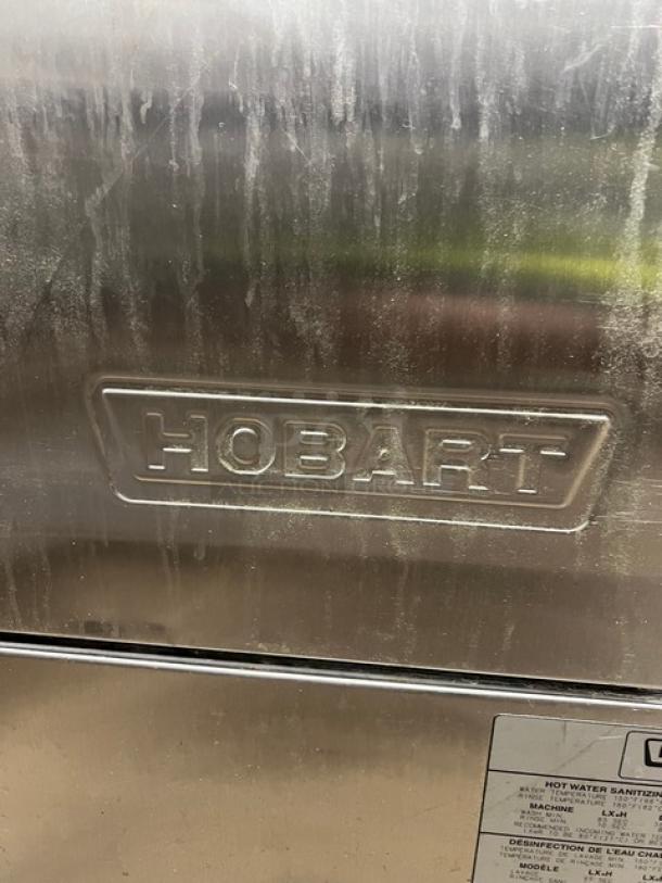 Hobart Advansys LXe Series stainless steel undercounter dishwasher, visible brand logo and model label, commercial quality.