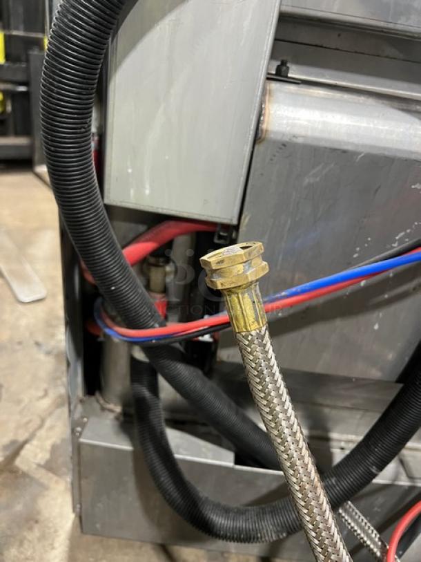 Hobart Advansys LXe series commercial undercounter dishwasher, stainless steel, visible plumbing hoses, good condition.