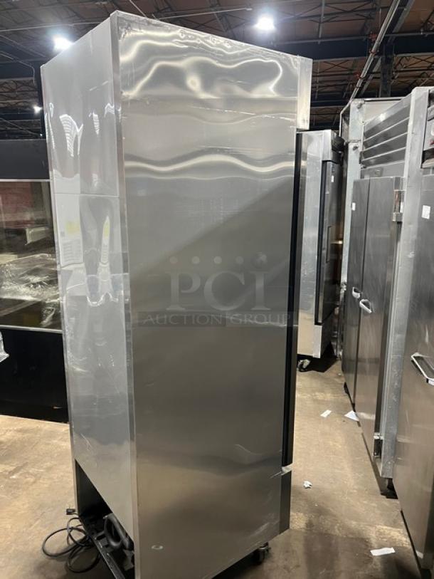 True T-23F single door stainless steel reach-in freezer, Energy Star certified, with poly-coated wired rack, on casters.