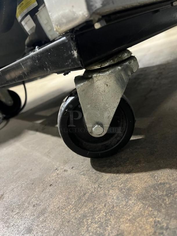 True T-23F reach-in freezer caster close-up, showing sturdy wheel design for mobility.