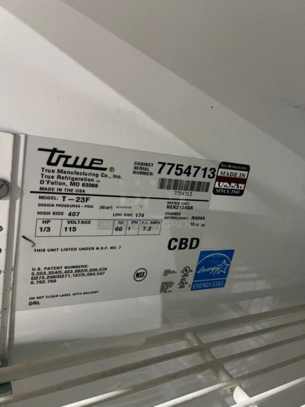 True T-23F commercial freezer label, Energy Star certified, model info, 115V, on casters, serial number 7754713.