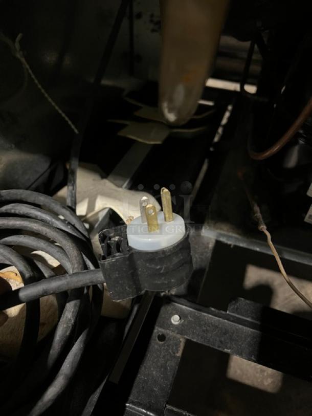 Power cord of True Commercial Stainless Steel Single Door Reach-In Freezer, Model T-23F, 115V, with visible plug connector.