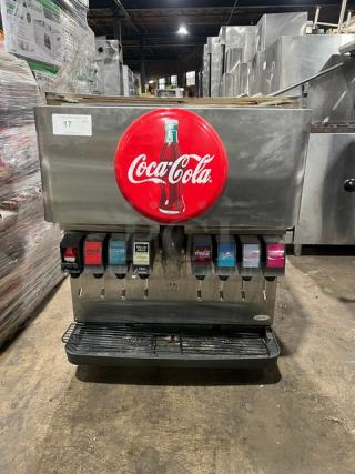 Cornelius ED200 Coca-Cola style 8-flavor beverage dispenser, stainless steel, with lever control and drip tray, 115V, on legs.