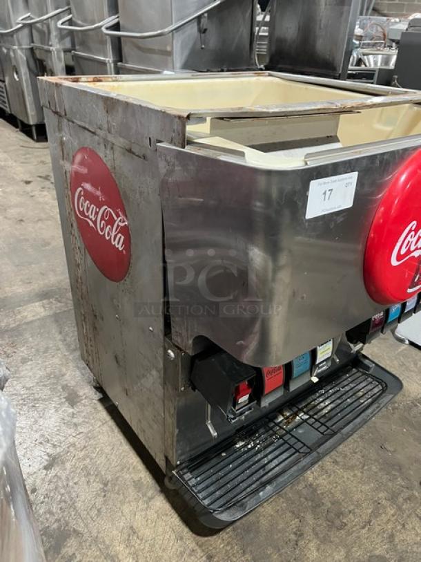 Cornelius ED200 Coca-Cola style 8-flavor beverage dispenser; stainless steel, self-serve levers, drip tray, model SN: 62B1429ED054.