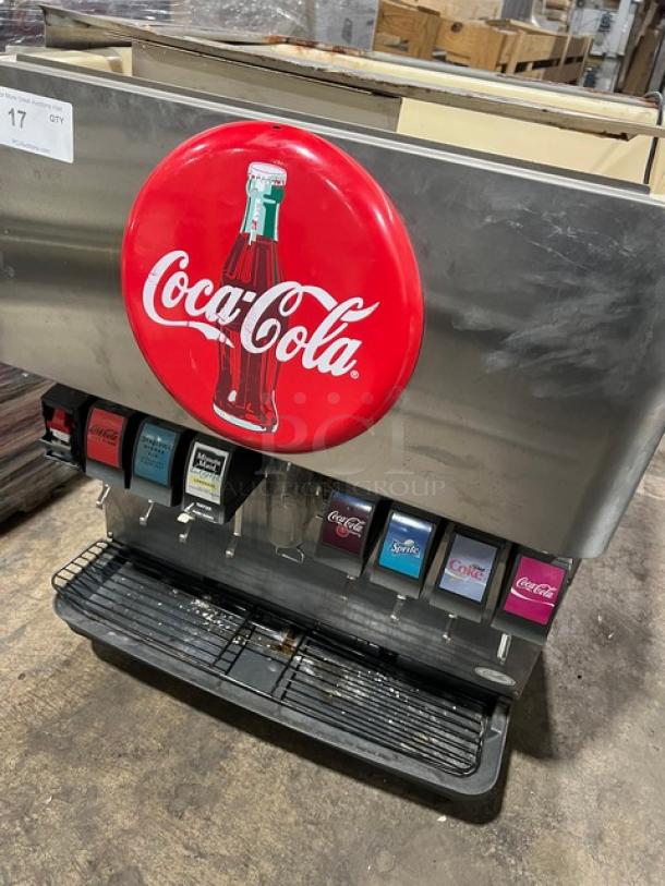 Cornelius ED200 Coca-Cola style 8-flavor beverage dispenser, stainless steel, electric, self-serve levers, drip tray, on legs.
