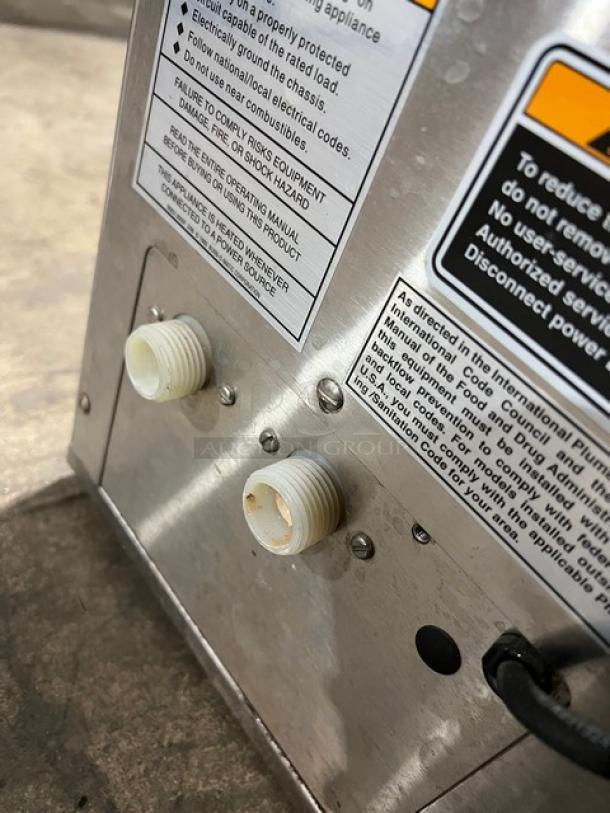 Bunn TB6Q Commercial Stainless Steel Iced Tea Brewer, 3 Gal, 120V, twin design, labels with safety and operating instructions visible.